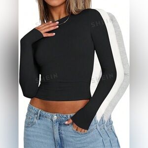 THREE cropped long sleeve shirts